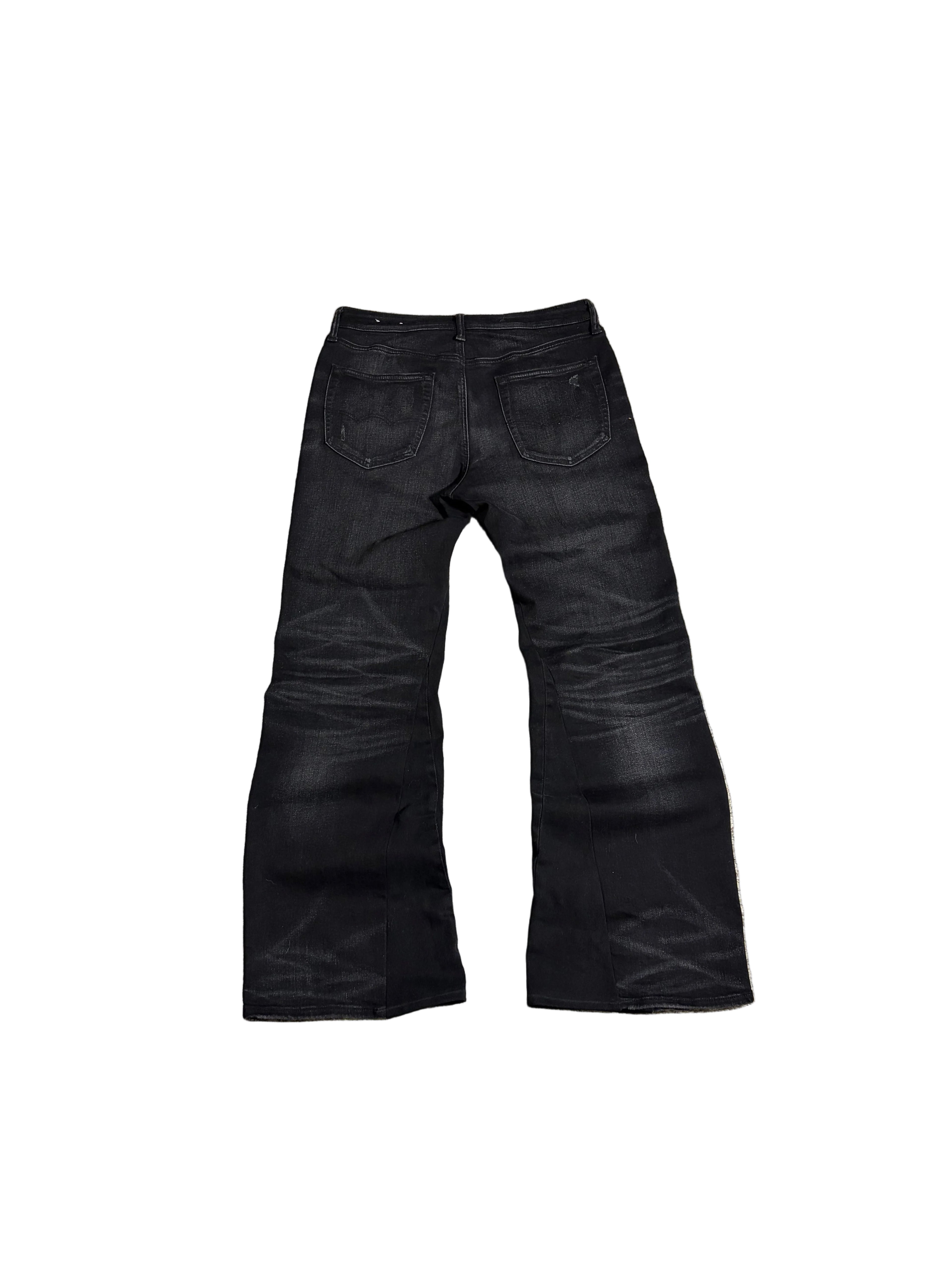 Distressed black flared jeans. Size: 32x34
