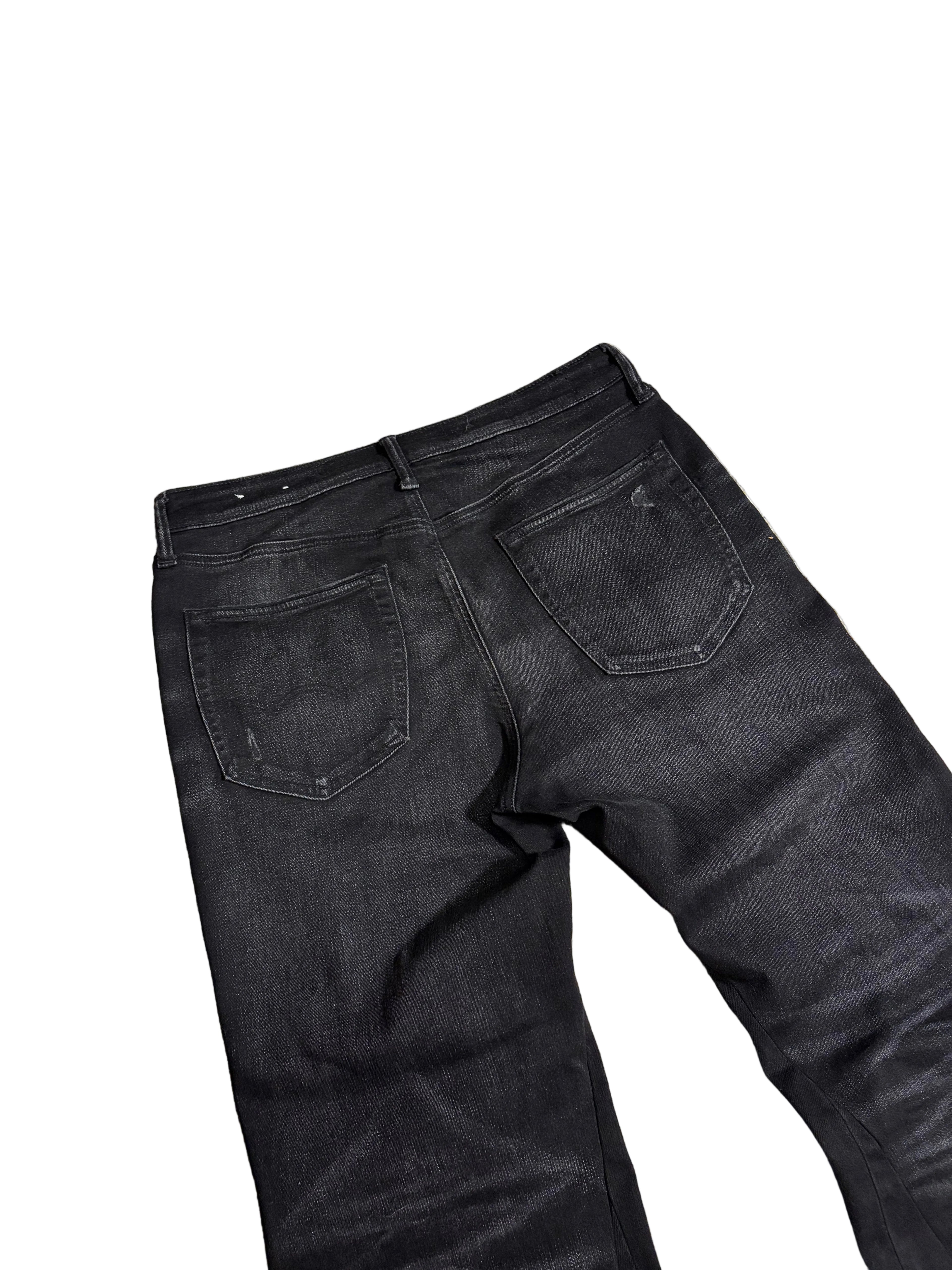 Distressed black flared jeans. Size: 32x34