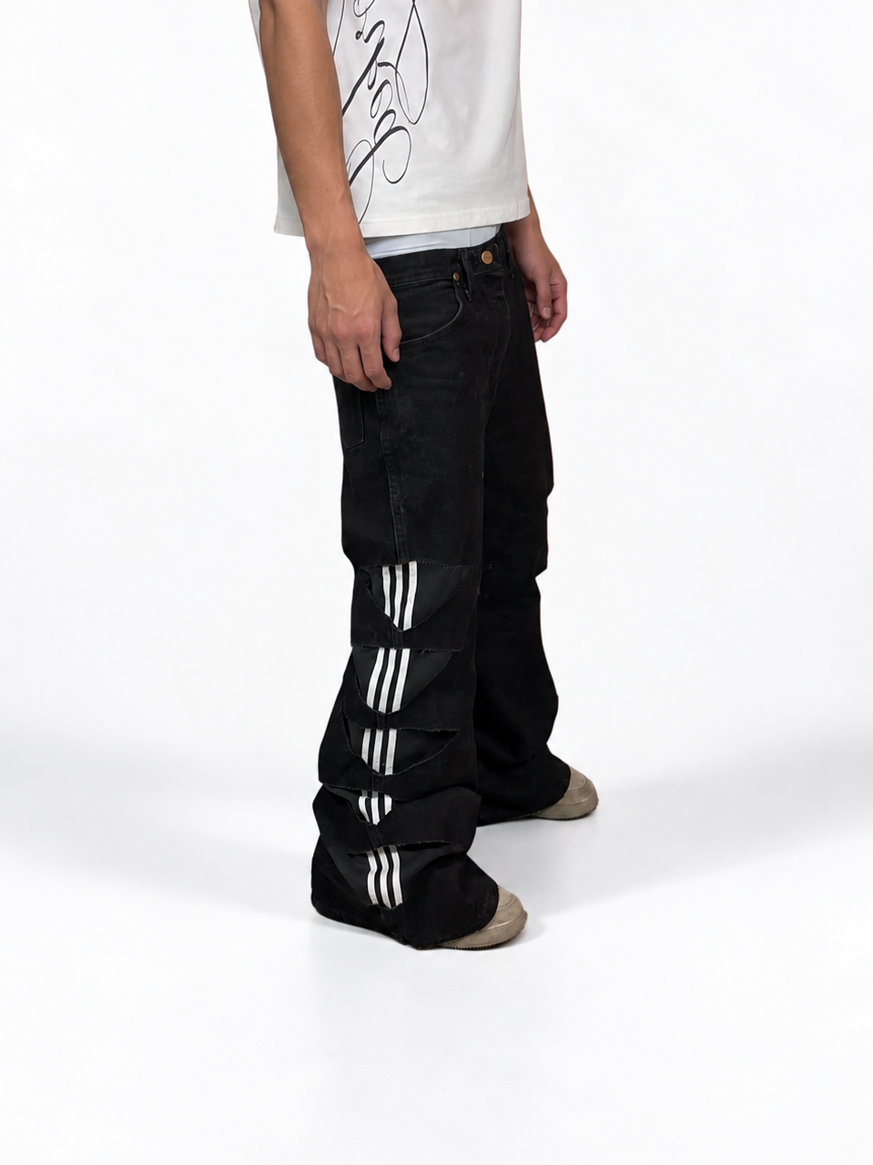 1of1 black adidas distressed baggy bootcut jeans. Size: 34x34