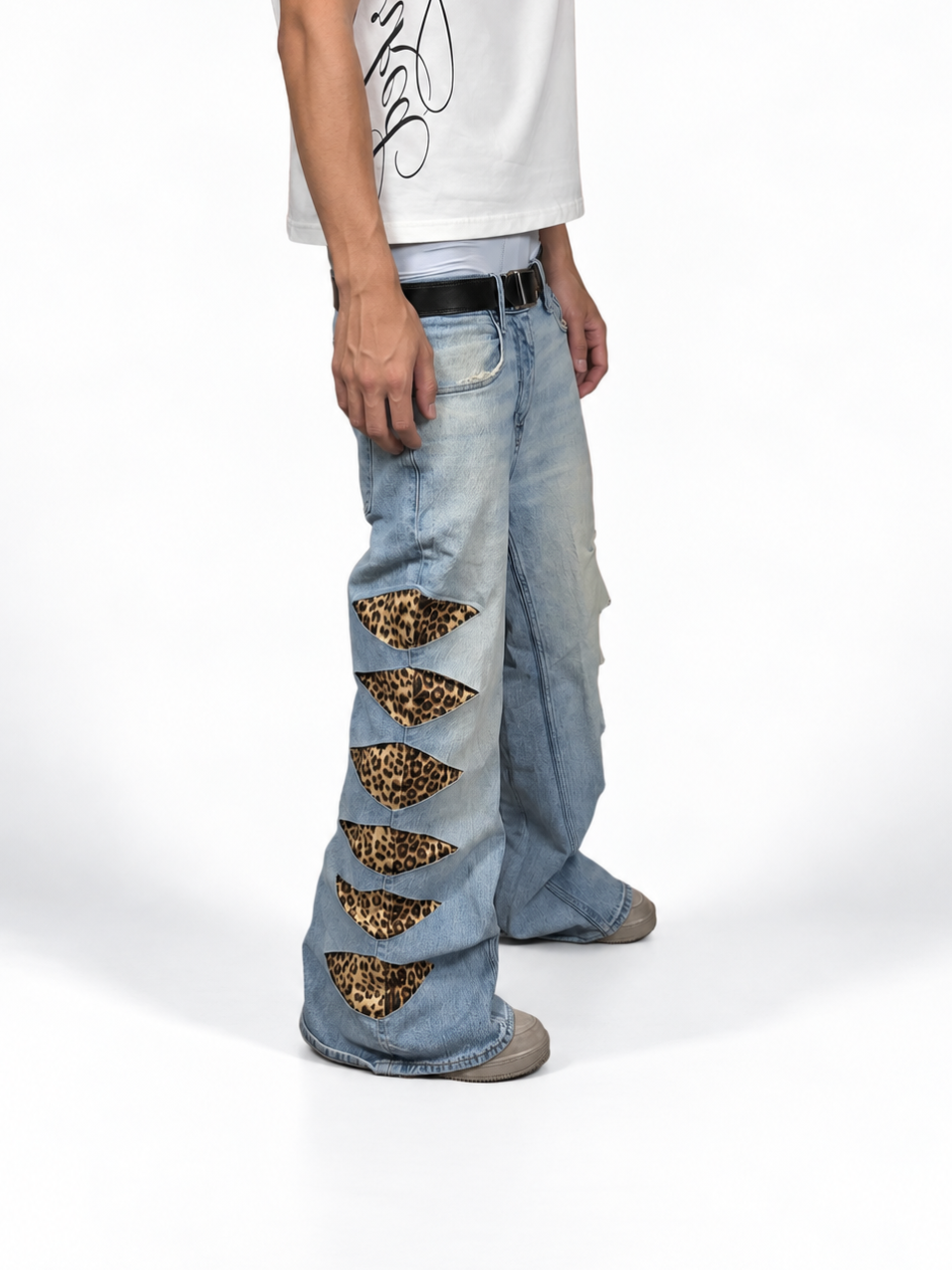 1of1 reworked light blue cheetah print distressed jeans. Size: 34x32